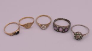 Three 9 ct gold rings (4.2 grammes total weight) and two silver rings.
