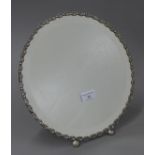 A Continental silver framed strutt mirror. 30.5 cm diameter.