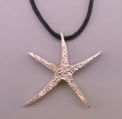 A Tiffany starfish form pendant. 4 cm x 3.5 cm.