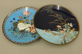 Two closionne chargers, one decorated with ducks and the other cranes. The former 30.5 cm diameter.