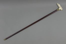 A bone handled walking stick, the handle formed as a nude woman. 93 cm long.