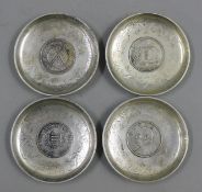 Four Chinese coin dishes. 9 cm diameter.