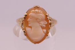 A 9 ct gold cameo ring. Ring size J/K. 1.9 grammes total weight.