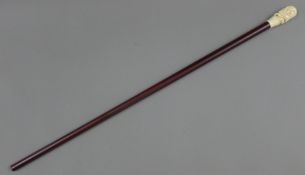 A bone handled walking stick, the handle formed as a rat. 90 cm long.