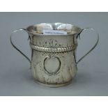 A Georgian silver porringer with twin handles. 8 cm high. 81.8 grammes.