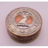 A Lovat's Scouts trench art type paperweight.