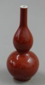 A small Chinese red porcelain double gourd vase. 16 cm high.