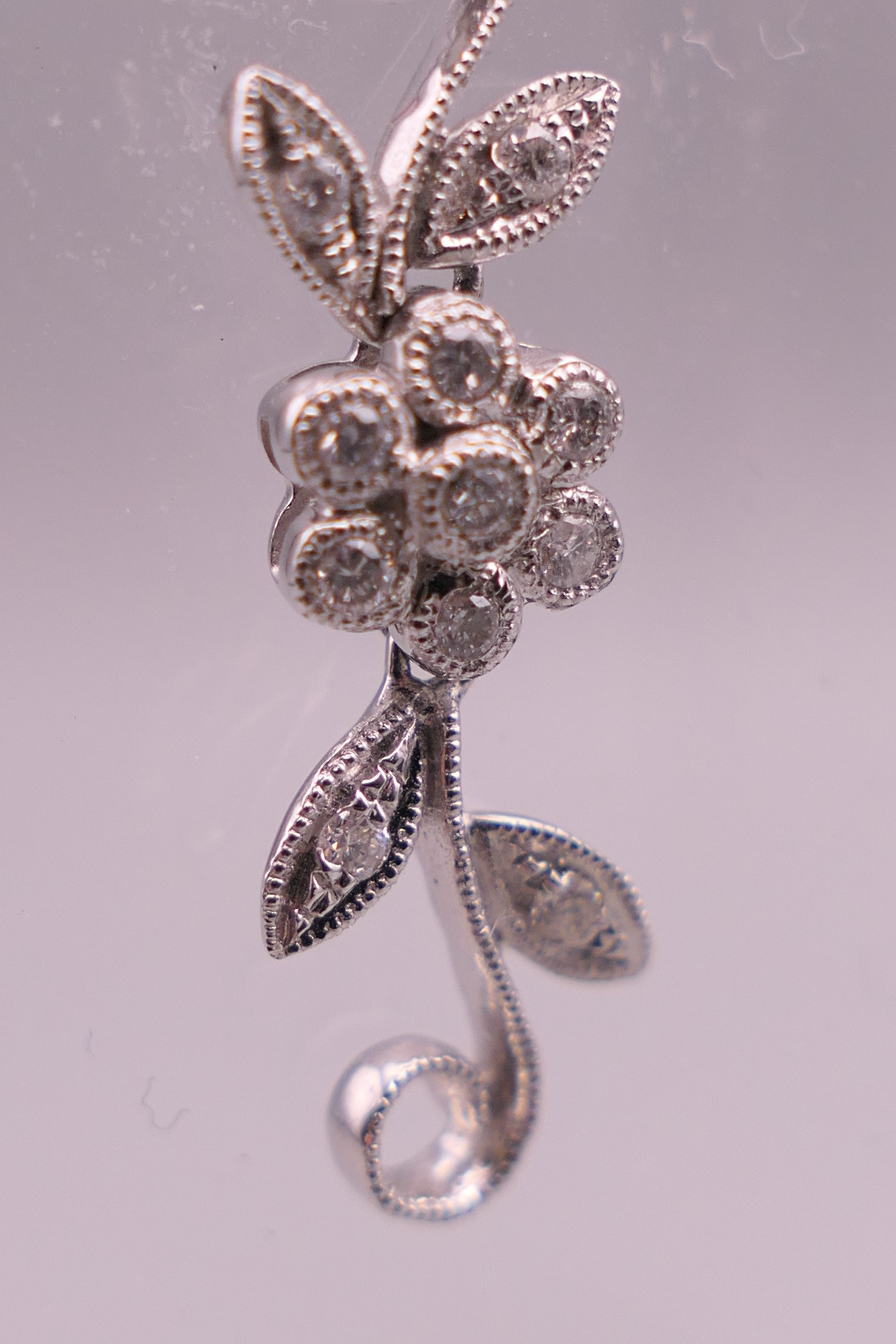 A pair of 18 ct white gold diamond flower drop earrings. Approximately 4 cm long. - Image 5 of 12