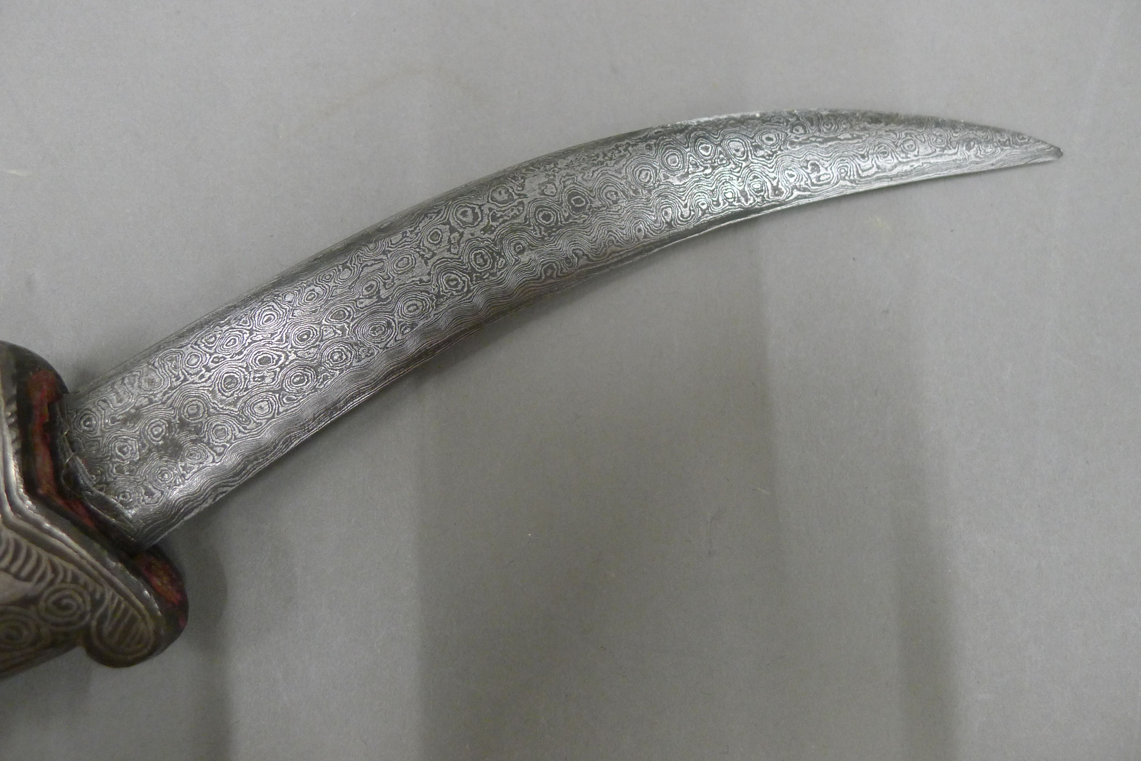 A 19th century Persian knife, the steel scabbard and grip inlaid with silver, - Image 5 of 6