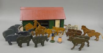 A wooden model of Norah's Ark, containing various animals and figures.