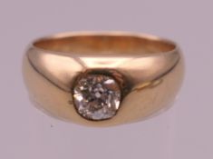 An unmarked gold diamond gypsy set ring. Ring size P/Q. 7.3 grammes total weight.