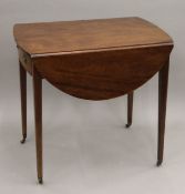 A 19th century mahogany Pembroke table. 76 cm long.