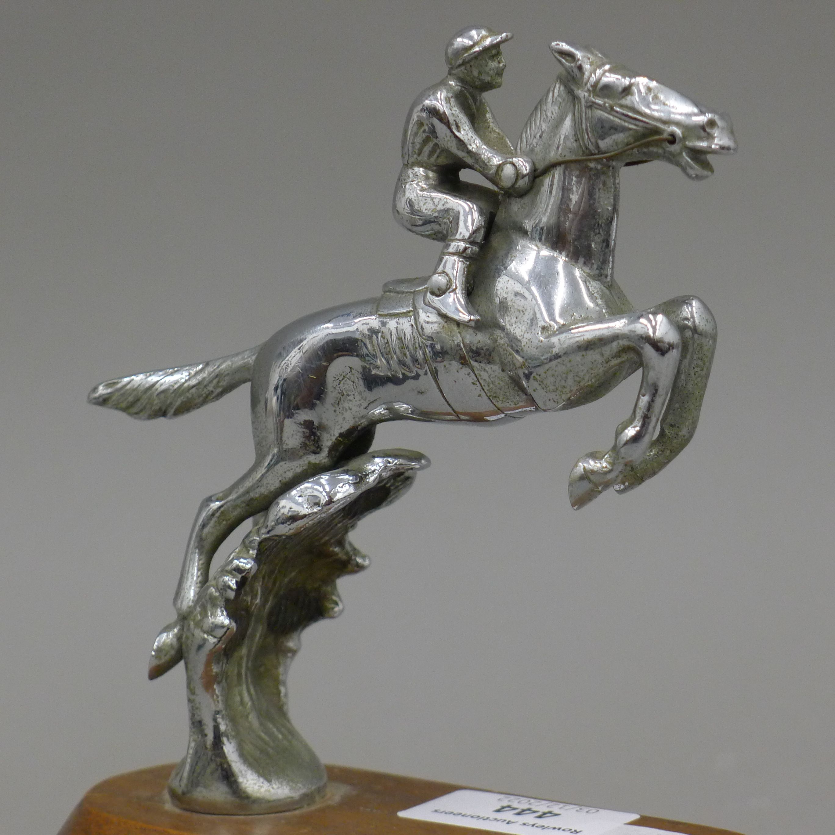 A mid-20th century car mascot formed as a leaping horse and jockey, mounted on a wooden stand. 17. - Image 3 of 3