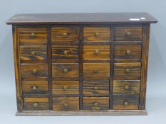 A vintage bank of drawers. 62 cm wide.