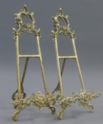 A pair of brass table easels. 49 cm high.