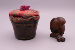 A tartanware box and a netsuke formed as a bird. The former 5.5 cm high.