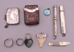 Two vestas, silver penknife, pendants etc. Silver vesta 4 cm high.