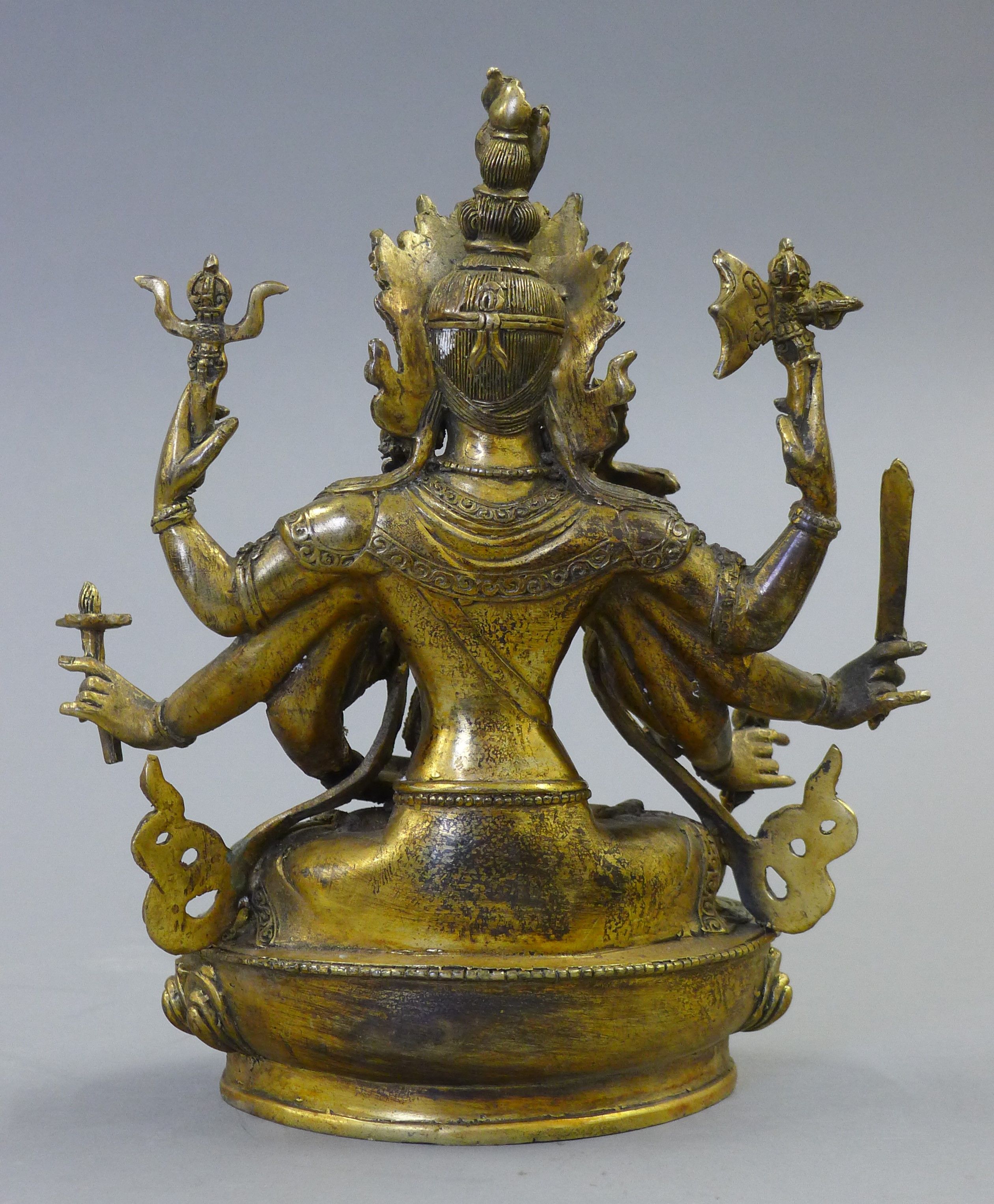 A gilt bronze model of a deity decorated with coral and turquoise. 21.5 cm high. - Image 4 of 5