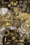 A quantity of horse brasses and other brassware.