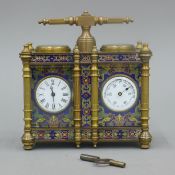 A double cloisonne carriage clock/barometer. 12.5 cm wide.