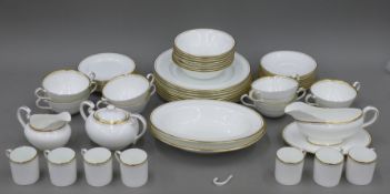 An Aynsley gilt heightened dinner service.