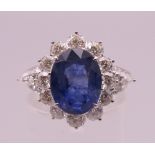 An 18 ct white gold sapphire and diamond ring, sapphire approximately 4.