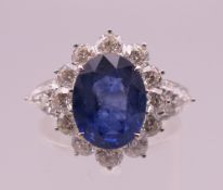 An 18 ct white gold sapphire and diamond ring, sapphire approximately 4.