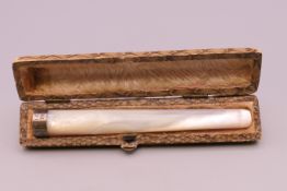 A cased mother-of-pearl cigarette holder, inscribed to band SERGTS ANNUAL SHOOT CARIO 1935.
