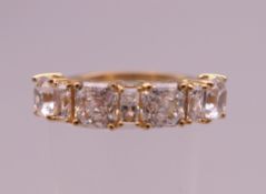 A 9 ct gold clear stone ring. Ring size Q. 3.5 grammes total weight.
