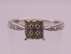 A 9 ct white gold diamond ring. Ring size K/L. 1.9 grammes total weight.