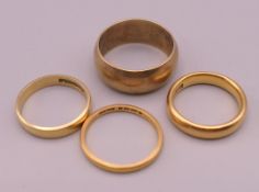 Four gold wedding bands, two 22 ct (7.4 grammes), one 18 ct (2.3 grammes) and the other 9 ct (5.