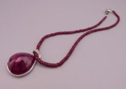 A single strand ruby necklace with ruby pendant. Pendant 4.5 cm high.