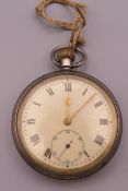A silver open face military pocket watch,