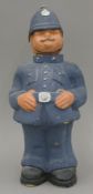 An early 20th century papier mache figure of Old Bobby with nodding head. 32 cm high.