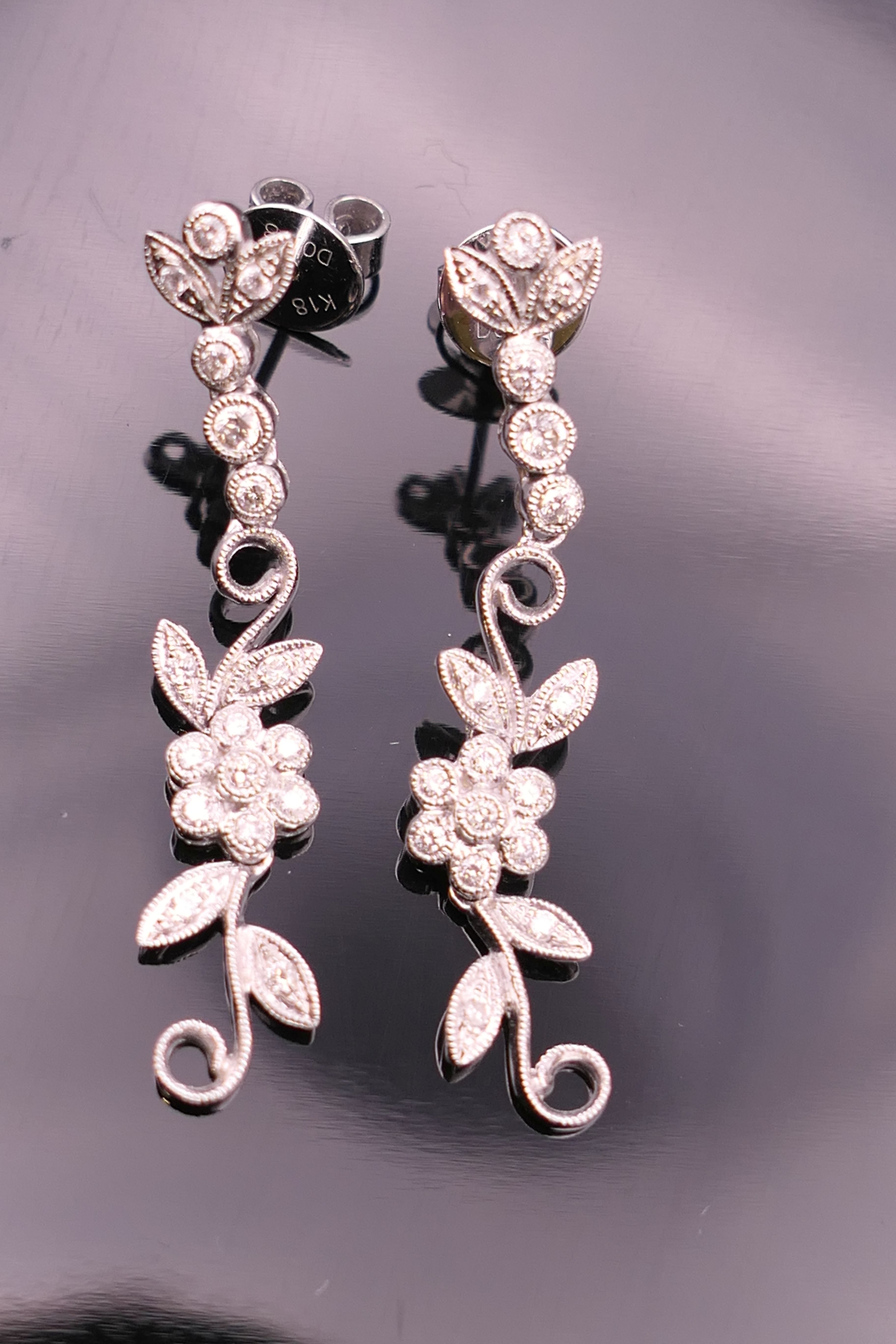 A pair of 18 ct white gold diamond flower drop earrings. Approximately 4 cm long. - Image 2 of 12