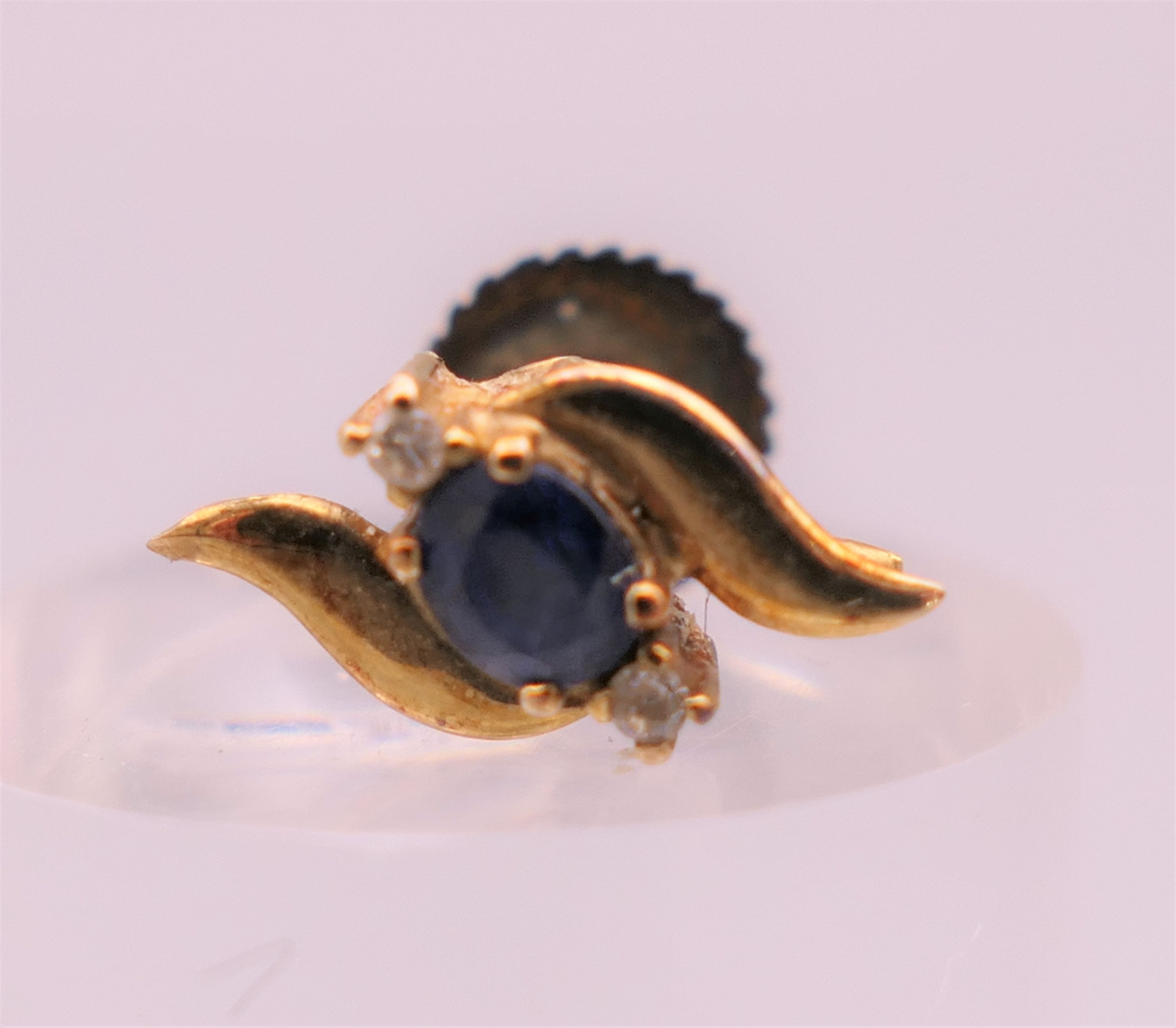 A pair of gold sapphire and diamond earrings. 1 cm high. - Image 2 of 4