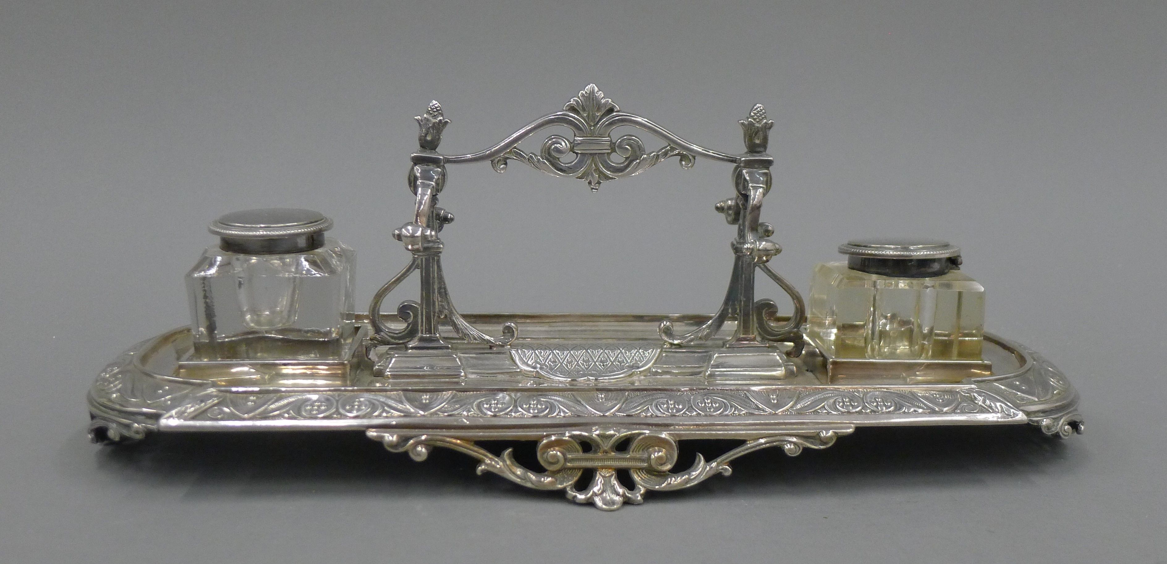 A Victorian silver plated desk stand, with associated inkwells. 32.5 cm long. - Image 2 of 4