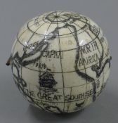 A bone globe compass. 7 cm high.