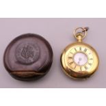 A ladies 18 C gold half hunter pocket watch. 56.7 grammes total weight.