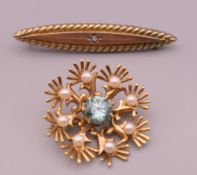 Two 9 ct gold brooches. One 3 cm diameter, the other 5 cm long. 7.1 grammes total weight.