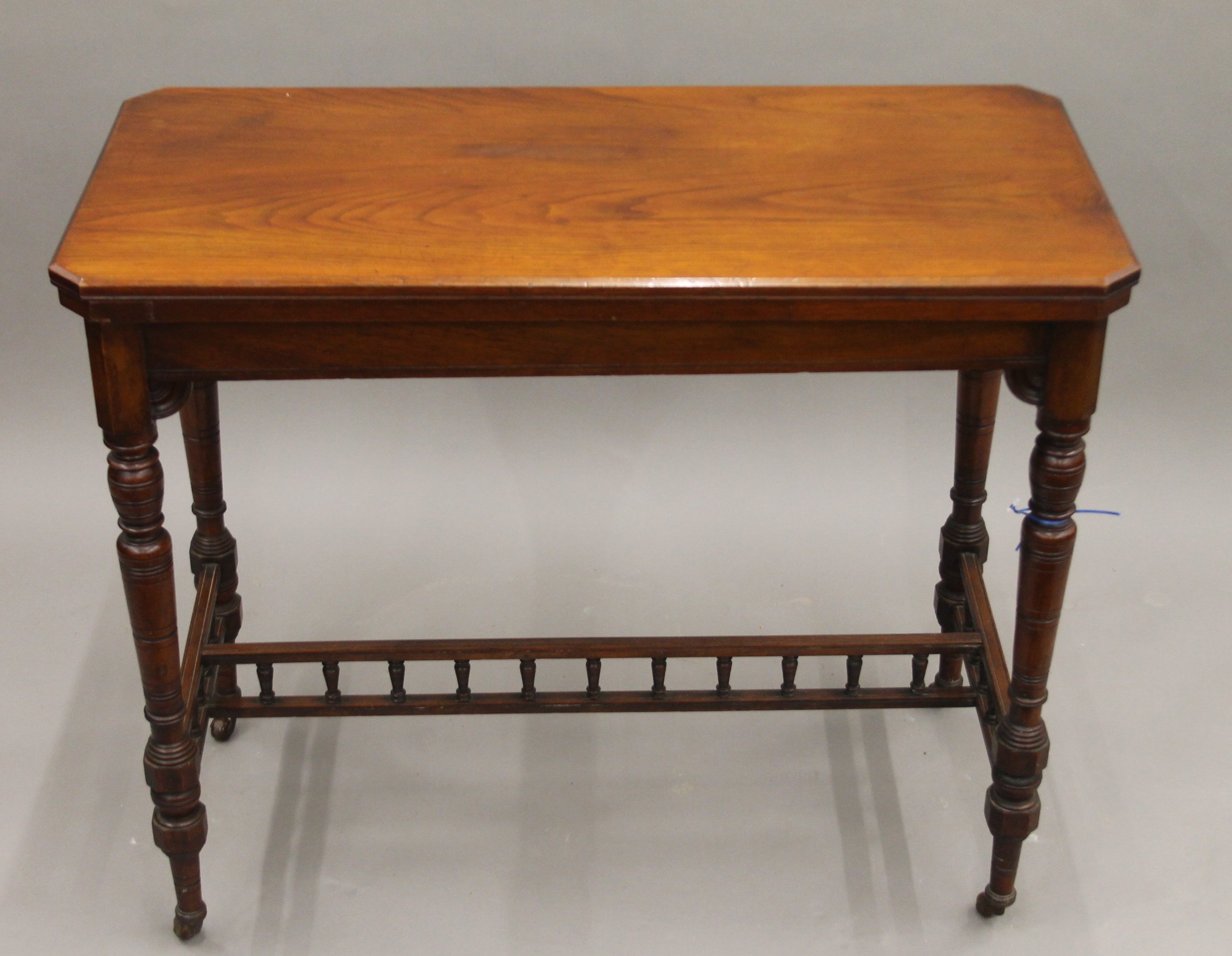 A Victorian walnut folding card table. 90 cm long.