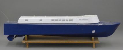 A large radio controlled boat. 117 cm long.