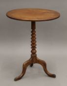 A 19th century mahogany bobbin turned tilt top tripod table. 57 cm long.