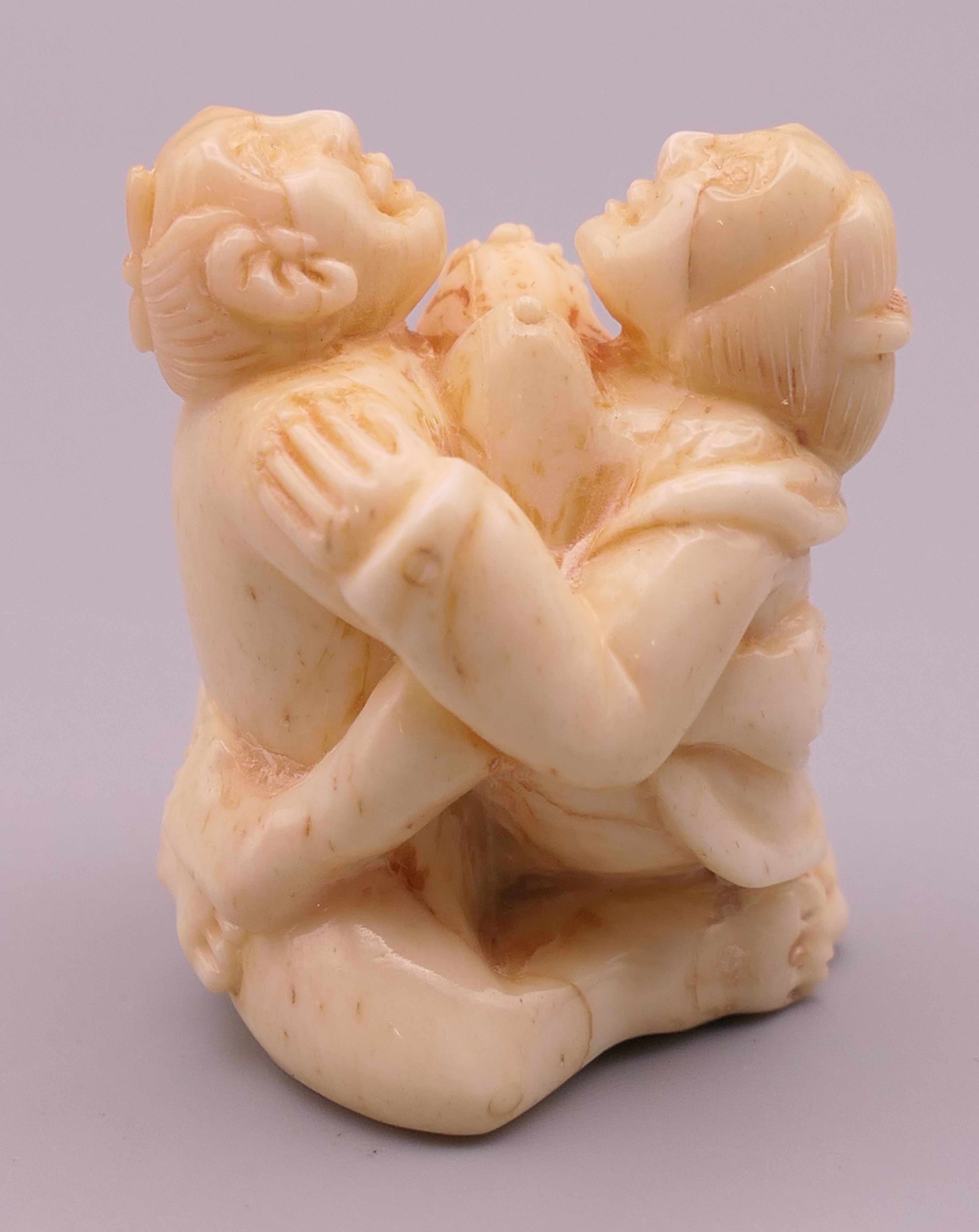 An erotic bone carving. 4 cm high.