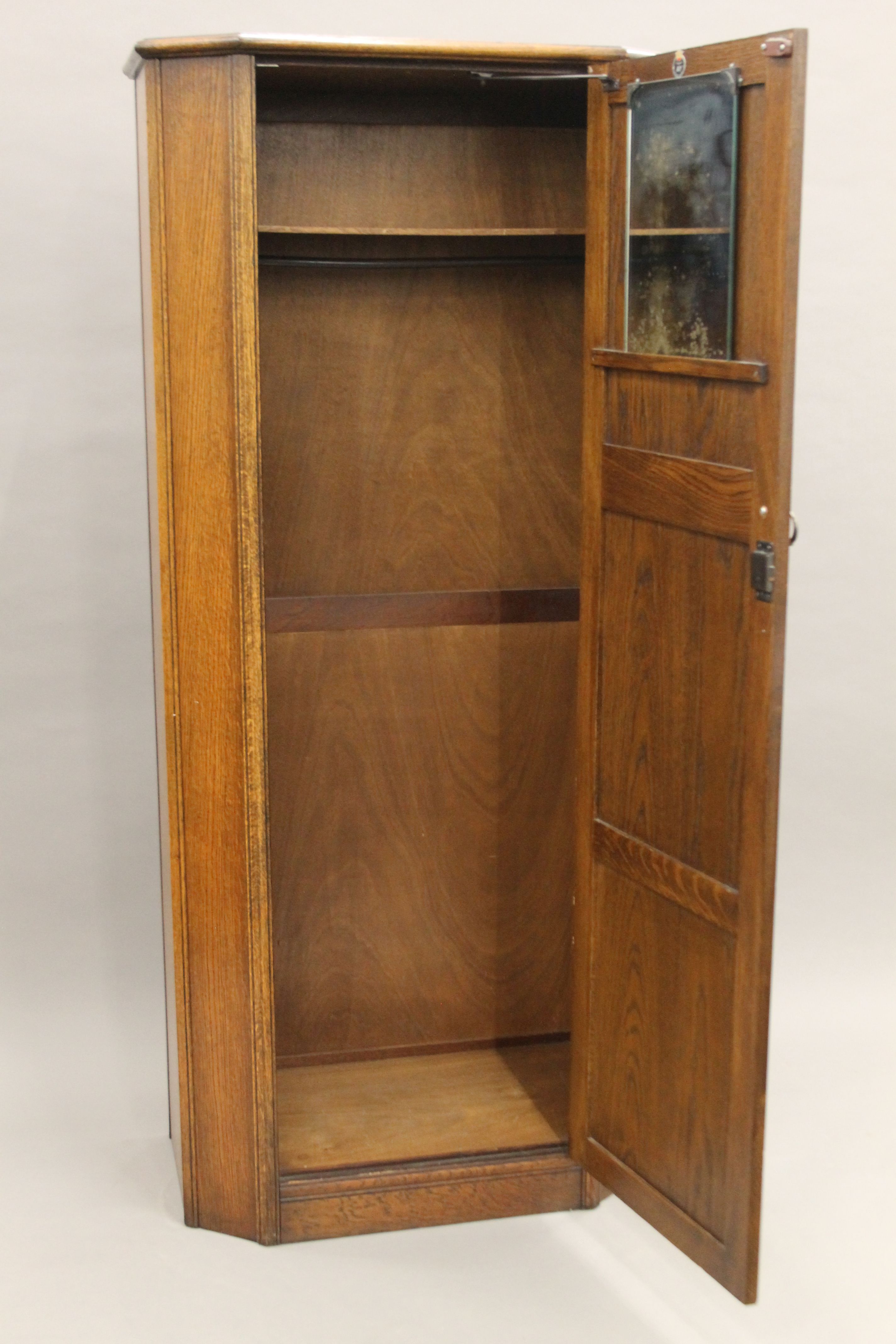 A mid-20th century oak veneered hall wardrobe and matching side cabinet. The former 177 cm high. - Image 5 of 10