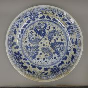 A Chinese blue and white porcelain charger. 60 cm diameter.