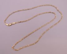 A 9 ct gold figaro chain. Approximately 52 cm long. 4.3 grammes.