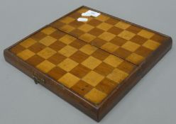 A Victorian mahogany games box. 26.5 cm wide.