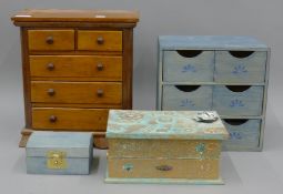 Two small banks of drawers and two jewellery boxes. The largest 35 cm high.