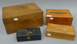 A Victorian walnut writing box, two jewellery boxes and a lacquered box. The former 30.5 cm wide.